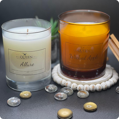 Two candles labeled Witch Hazel on their sides, placed side by side against a neutral background.